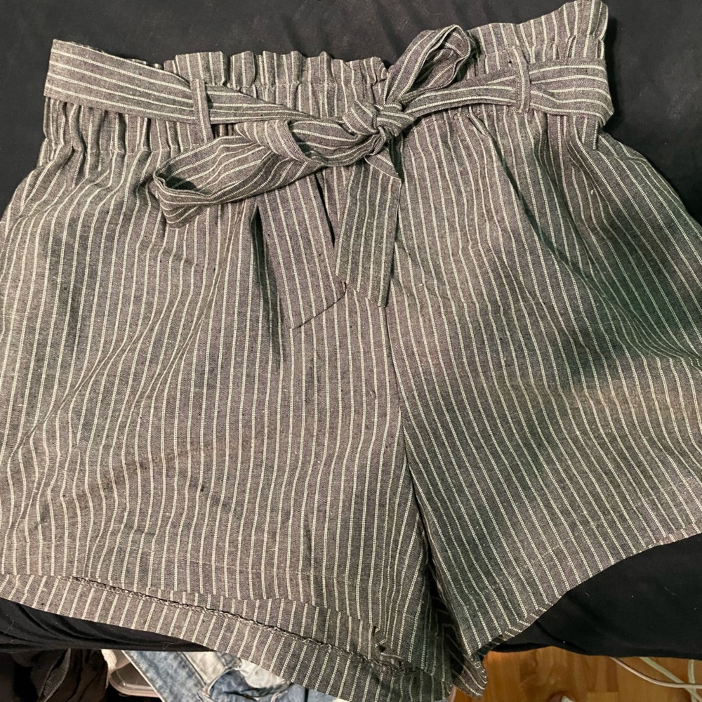 Blue and white pin stripped shorts with tie belt. Never wore, comfy and casual.